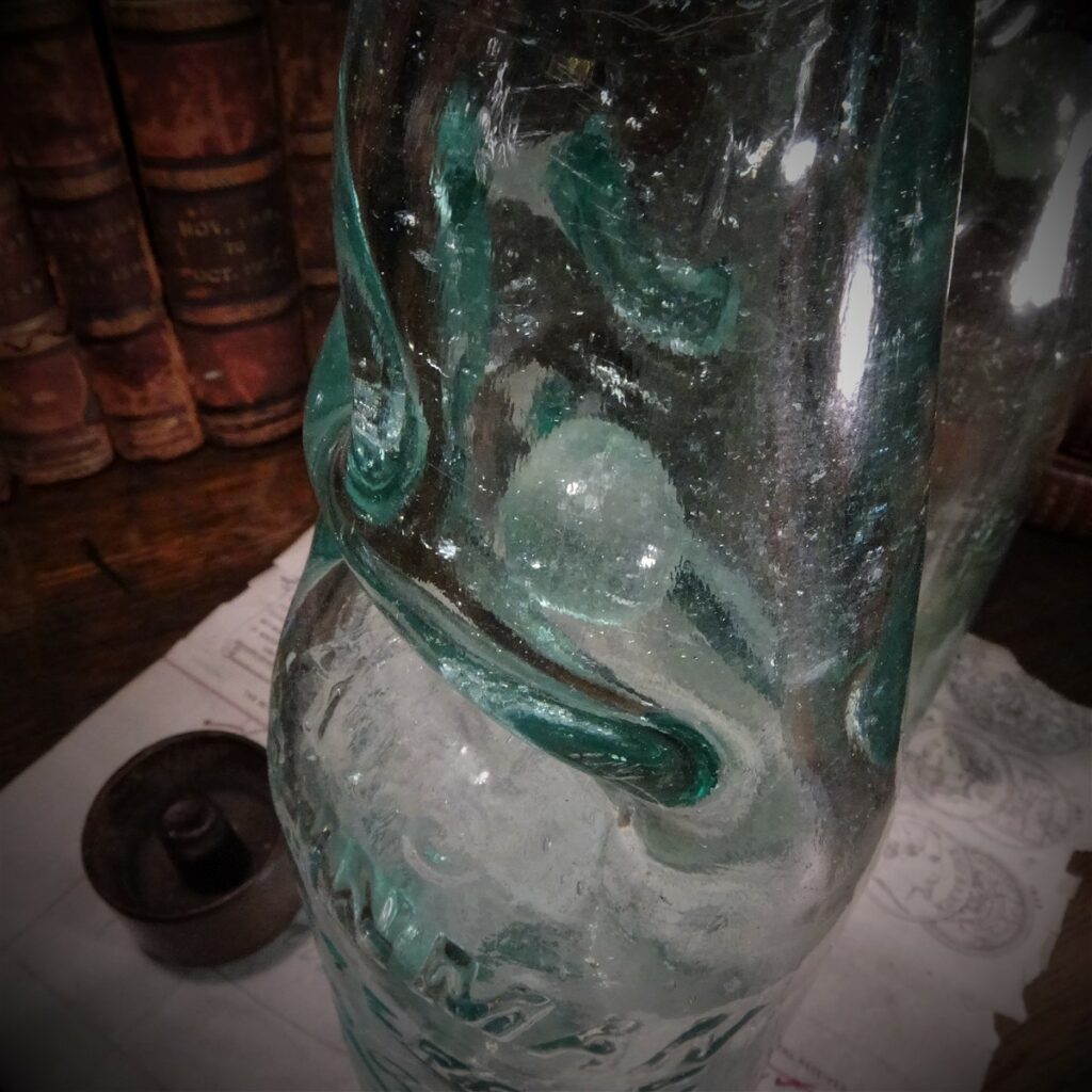 The Marble Sitting in its Chamber at the Side of the Bottle